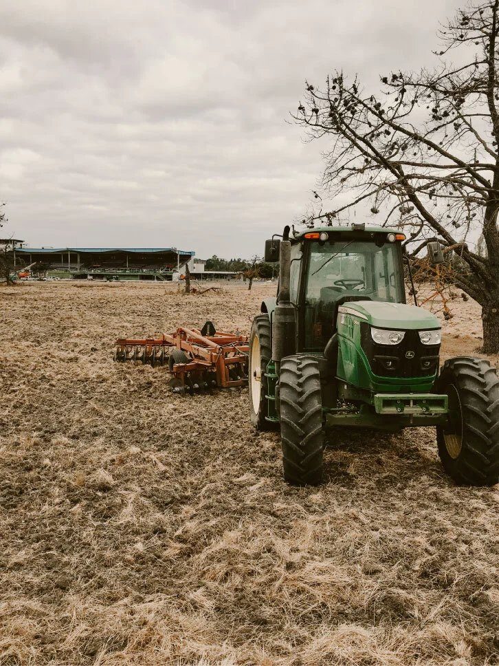 Tractor and disc in a dry field for fire prevention